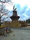 Potsdam / Germany - March 24 2018: An actor dressed as Frederick the Great plays the flute at the entrance to the park Sans Souci