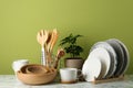 Potted plant and set of kitchenware on white marble table. Modern interior design Royalty Free Stock Photo
