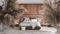 Potted straws with pebbles, dry plants, ornament, ears, sheaf, branch in vase over minimalist wooden bedroom with double bed,