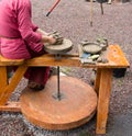 Potter hands making in clay on pottery wheel. Potter makes on the pottery wheel clay pot. Royalty Free Stock Photo