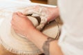 Potter hands shaping clay top view Royalty Free Stock Photo