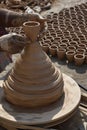 Potter made a clay pot on potter wheel Royalty Free Stock Photo