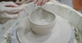 Potter making ceramic pot on pottery wheel Royalty Free Stock Photo