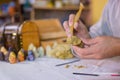 Potter making clay figure for board game Royalty Free Stock Photo