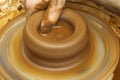 Potter making clay pot