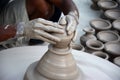 Potter making diyas clay lamps before diwali festival