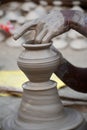 Potter making diyas clay pot before diwali festival