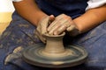 Potter modeling ceramic pot from clay on a potter& x27;s wheel. Workshop, art concept Royalty Free Stock Photo