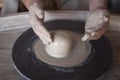 Potter`s wheel with clay. Women`s hands make a vase of clay Royalty Free Stock Photo