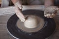 Potter`s wheel with clay. Women`s hands make a vase of clay Royalty Free Stock Photo