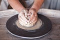 Potter`s wheel with clay. Women`s hands make a vase of clay Royalty Free Stock Photo