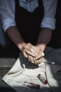 The potter`s woman hands are shaping a cup from a clay. The process of creating pottery. The master ceramist works in Royalty Free Stock Photo