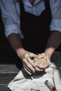 The potter`s woman hands are shaping a cup from a clay. The process of creating pottery. The master ceramist works in Royalty Free Stock Photo