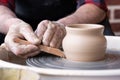 Potter wheel and hands of craftsman making a jug Royalty Free Stock Photo