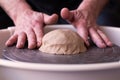 Potter wheel and hands of craftsman making a jug Royalty Free Stock Photo