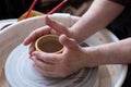 Potter wheel and hands of craftsman making a jug Royalty Free Stock Photo