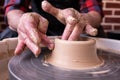 Potter wheel and hands of craftsman making a jug Royalty Free Stock Photo