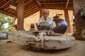 Potter at work makes ceramic dishes. India, Rajasthan Royalty Free Stock Photo