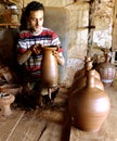 The potter working