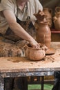 Potter working on the lathe. Royalty Free Stock Photo