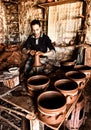 The potter working