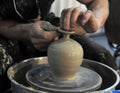 A potter works on a pottery wheel Royalty Free Stock Photo