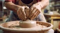 Potter& x27;s hands molding clay vase on a potter& x27;s wheel. Tactile process of pottery-making, earth tones or muted