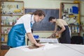 Pottering and Clay Making Process Concepts. Couple of Two Professionals Royalty Free Stock Photo