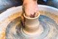 Pottering - creating a clay cup in process Royalty Free Stock Photo