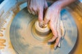 Pottering - creating a clay cup in process Royalty Free Stock Photo