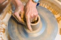 Pottering - creating a clay cup in process Royalty Free Stock Photo