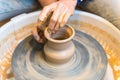 Pottering - creating a clay cup in process Royalty Free Stock Photo