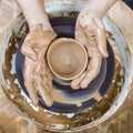 Pottering Ideas. Closeup of Dirty Male Potter Hands Moulding Jar Royalty Free Stock Photo