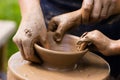 Potters and child hands