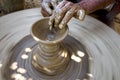 Potters hand and his wheel making diva Panti in clay at Maheshwar