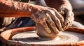 potters hands shaping clay on the pottery wheel