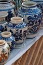 Handmade pottery urns and pots with different painting stiles Royalty Free Stock Photo