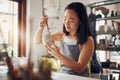 Pottery, art and design with an asian woman in a studio for her creative ceramics hobby as an artisan. Manufacturing