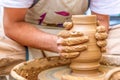 Pottery artist making clay pot in a workshop