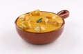 Pottery bowl chicken curry tandoori shish with sauce on white background