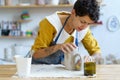 Pottery hobby or ceramic manufacture small business: young artist molding jug of raw clay in studio Royalty Free Stock Photo