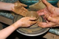 Pottery making process. Ceramic from clay. Art of pottery. Master class from clay on a potter`s wheel. Hands of potters creating Royalty Free Stock Photo