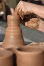 Pottery male ceramist creates a hand made clay product Royalty Free Stock Photo
