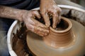 Pottery. The master at the potter`s wheel, produces a vessel of clay