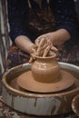 Pottery. The master at the potter`s wheel, produces a vessel of clay