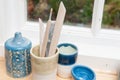 Pottery tools and vases on a window ledge