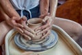 Pottery. Two young men. Close-up hands working on a vase Royalty Free Stock Photo