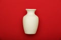 Pottery, vase, white clay jug isolated on red background. Pottery mockup made from white clay on a red background. Royalty Free Stock Photo