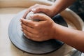 Pottery wheel, clay, woman`s hands, potter is going to work in pottery Royalty Free Stock Photo