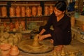 Pottery wheel and Vietnamese woman